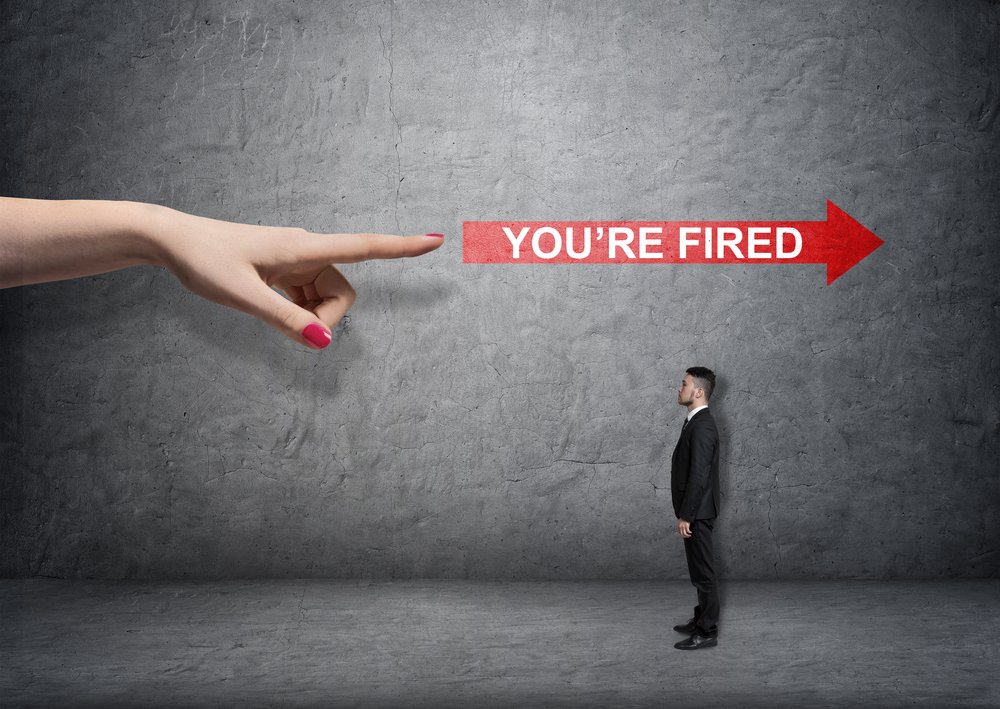 A finger pointing at a worker away from his current direction.