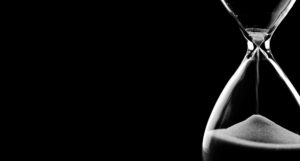Hourglass against black background