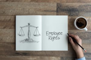 Open book that says "employee rights"