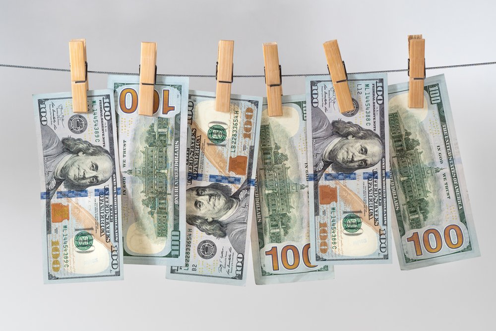 Hundred-dollar bills on a clothes line to illustrate money laundering