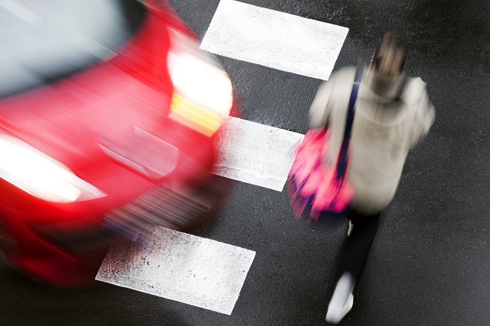 Pedestrian about to get hit at a crosswalk.