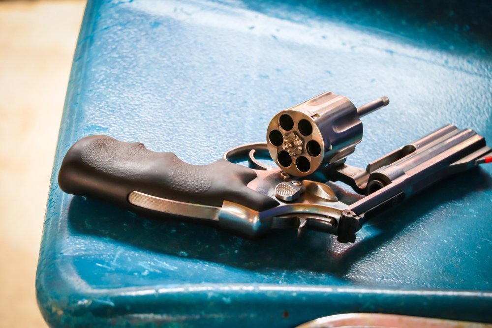 An unloaded revolver with the cylinder open - Penal Code 26350 PC makes the open carry of unloaded firearms a crime in California