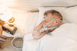 Man sleeping with cpap device