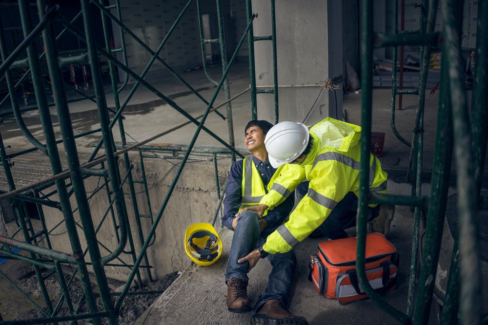 A construction worker hurt on the ground after a scaffolding accident - our scaffolding accident lawyers represent victims across the United States