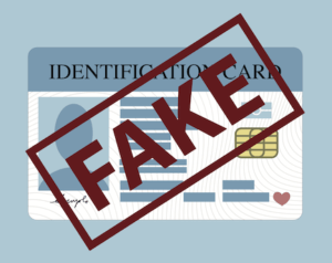 Cartoon of ID card with word "fake" stamped on it to illustrate a NRS 205.460 crime