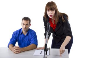 Public defender in court advocating for defendant during a hearing