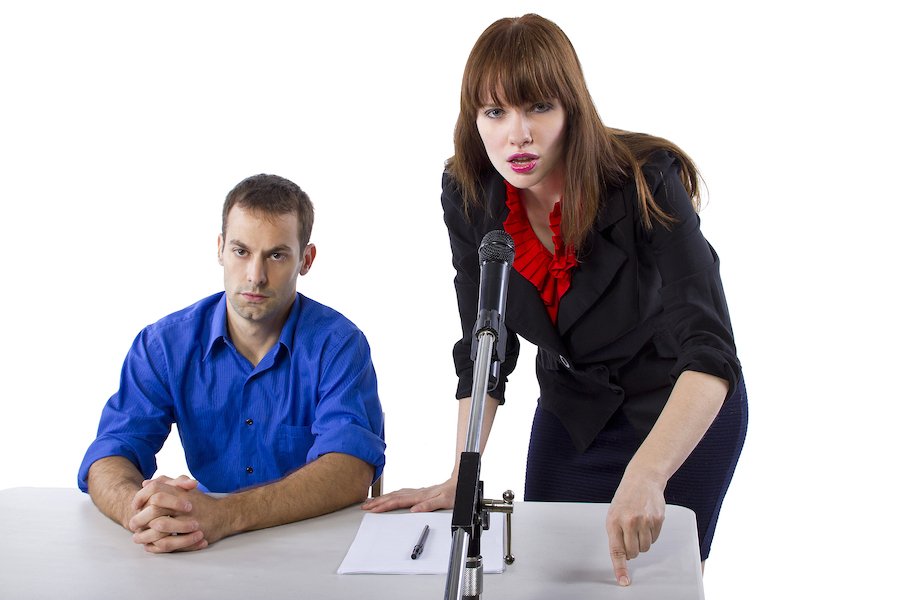 Defense attorney in court advocating for defendant during a probation violation hearing