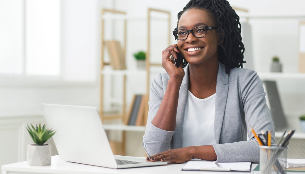 Woman on the phone filing a claim.