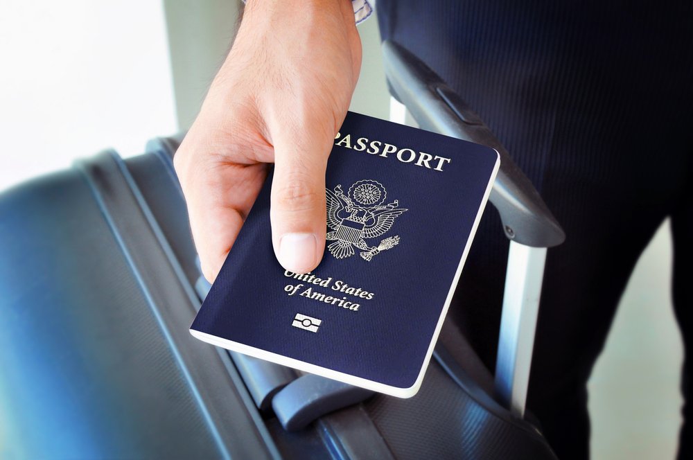 A man holding his American passport.