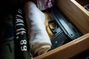 Gun being hidden in drawer by convicted felon in violation of NRS 202.360