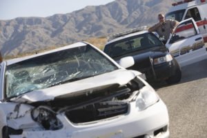 Two cars after a crash by the side of a road