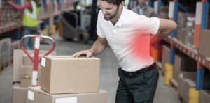 Warehouse worker grabbing back in pain