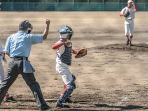 A baseball umpire calling an out.