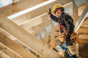 Builder in hard hat contracitng in accordance with 7028 BP.