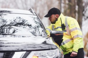 Driver stopped by a police officer.