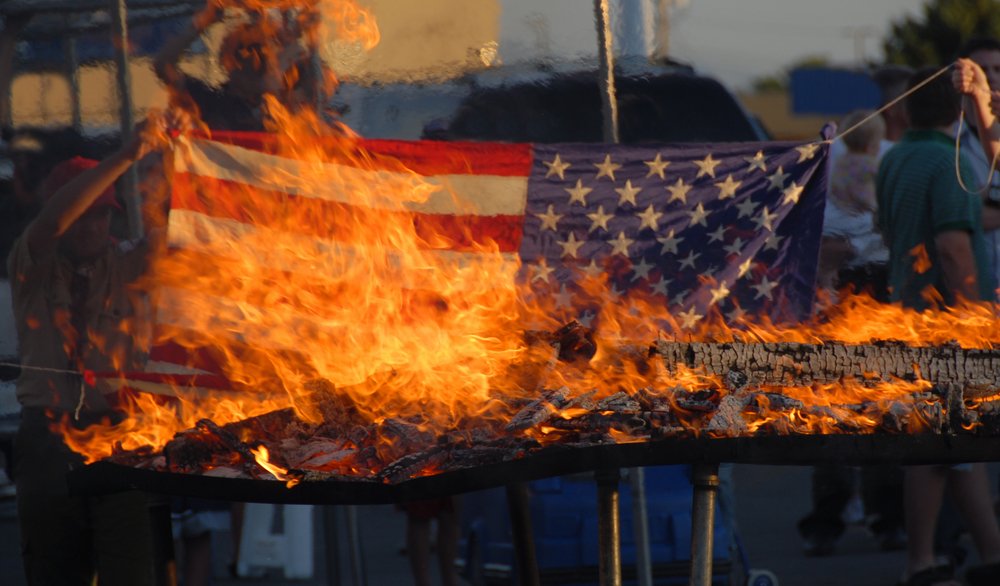 An American flag being burned.