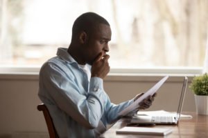 A man shocked by a bill he just received.