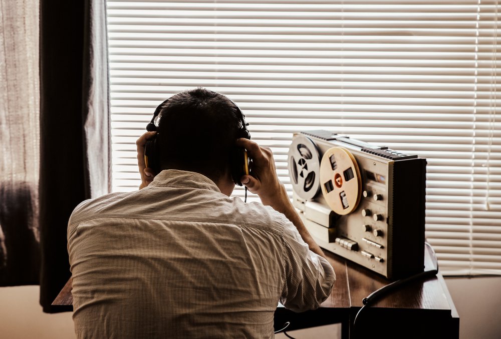 A person listening in, and recording, a call.