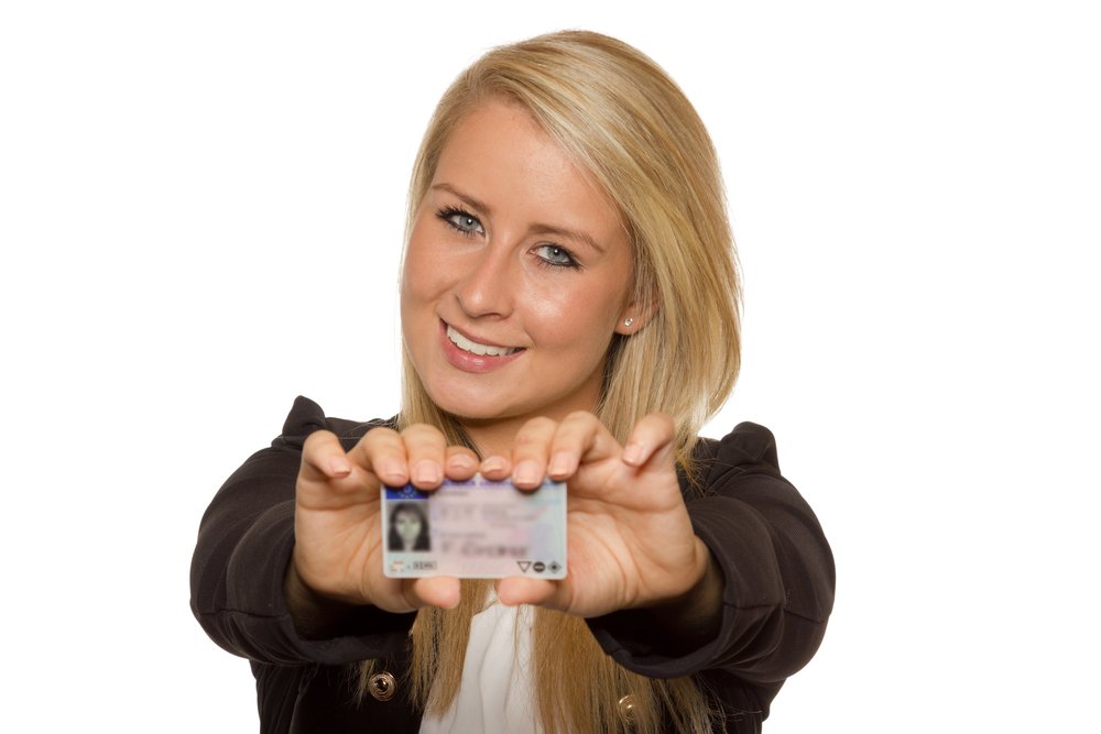 A woman showing her ID card.