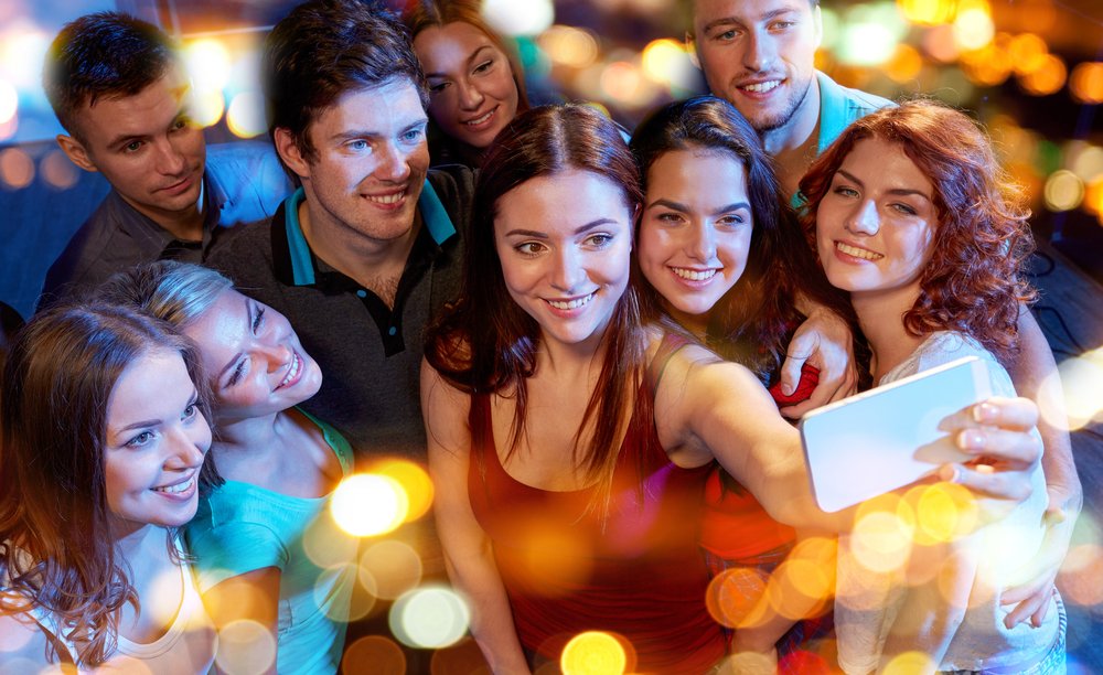 A group taking a photo at a party.