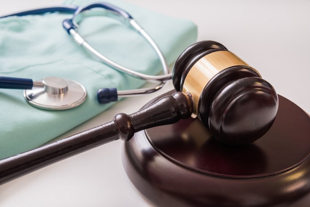 A gavel sitting next to a physician's stethoscope.