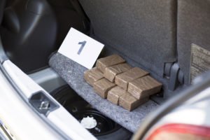 Packages of drugs in the trunk of a car.