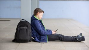 Child playing on cell phone