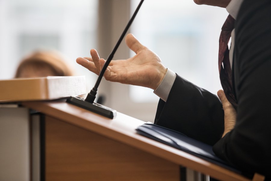 Attorney at podium arguing in front of a judge
