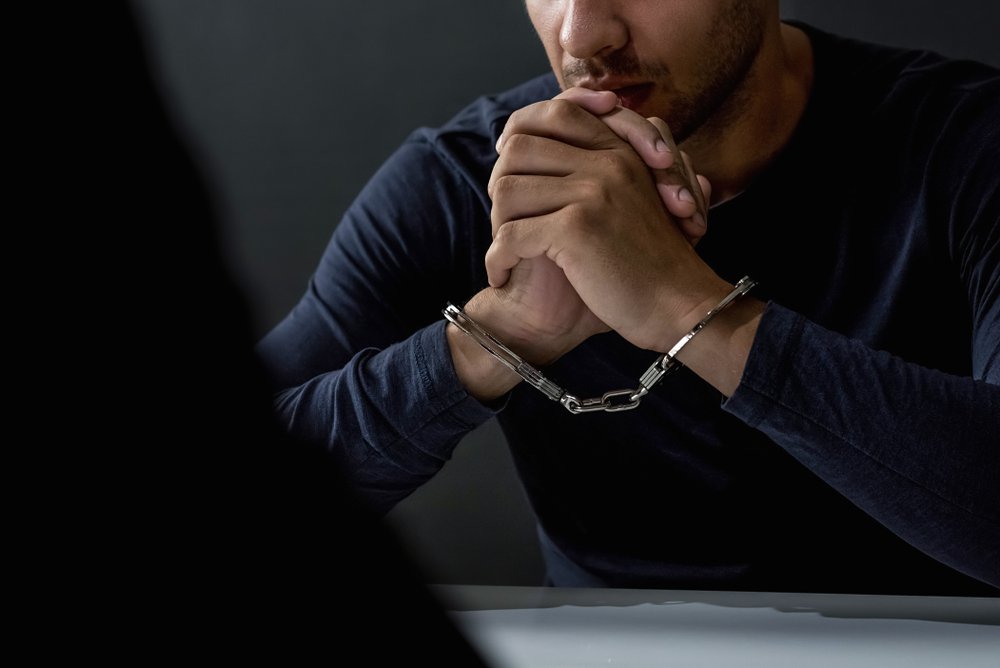 A possible probation violator in handcuffs.