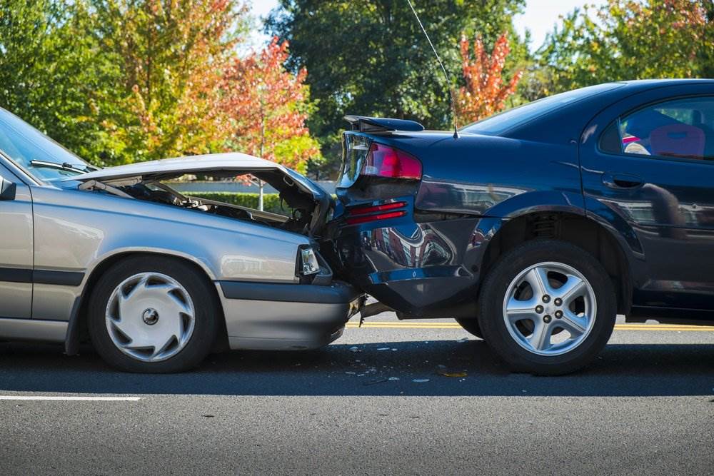 A rear-end car accident involving two vehicles.