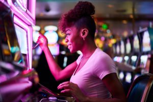 Woman playing a slot machine