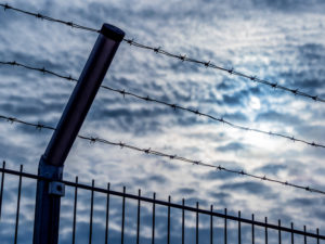 a fence with barbed wire