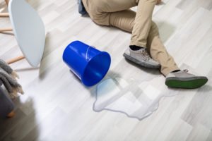 Man on floor after spilling on wet floor