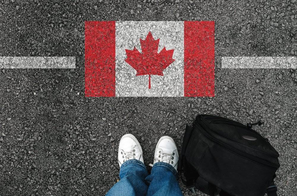 A Canadian flag imprinted on the border line.
