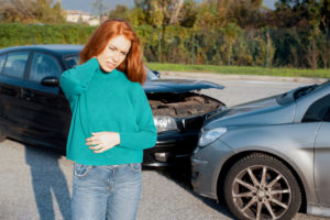 Driver holding her neck following fender bender