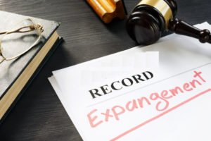 paper that says "record expungement" with gavel