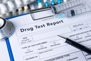 A drug test report about to be filled out by technician.