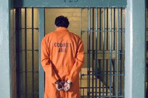 An inmate entering his jail cell for his misdemeanor conviction.