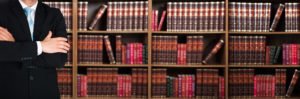 Attorney against shelf of legal books