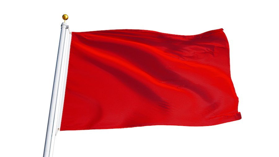 Red flag waving in wind