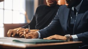 Attorney and client at counsel table during trial