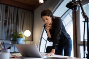 Woman staring at laptop