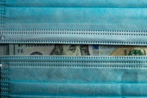 Face mask and $100 bill