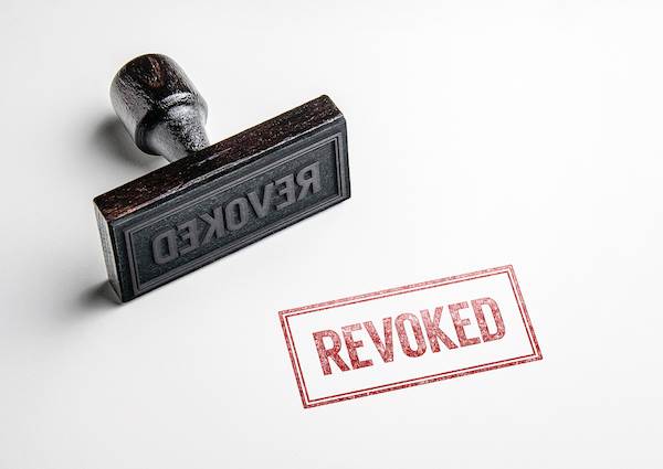 Stamp saying "revoked"
