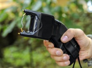 Hand holding stun gun