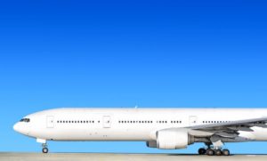 Airplane on ground against blue sky