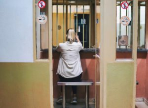 Woman visitor waiting in a jail to see an inmate 