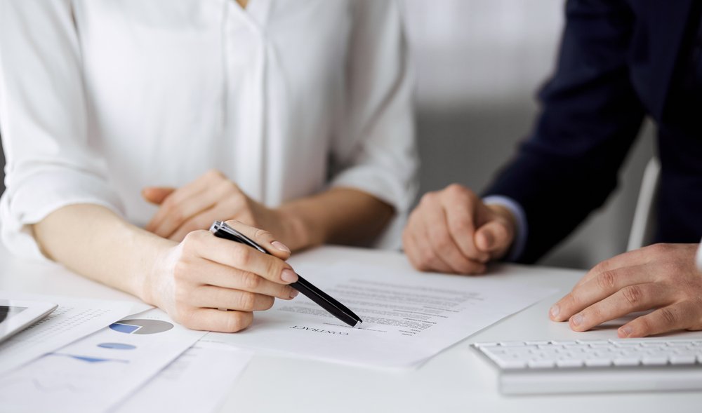 An employee looking over a severance agreement.