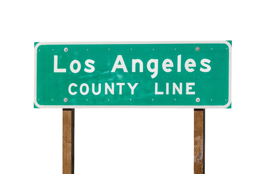 A sign indicating the Los Angeles county line.