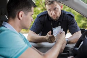 Policeman during traffic stop asking to see driver's license